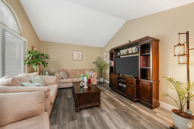 3561 S Jenelles Bay, West Valley City, UT 84119 - living area featuring lofted ceiling and light wood finished floors