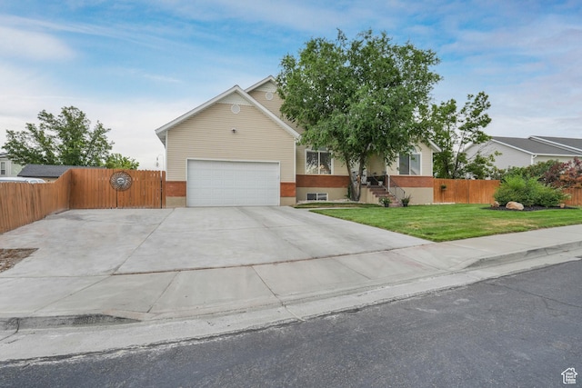 3561 S Jenelles Bay, West Valley City, UT 84119 - view of property hidden behind natural elements featuring driveway and an attached garage