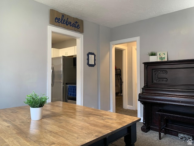 2425 Van Buren Ave, Ogden, UT 84401 - carpeted dining area featuring a textured ceiling