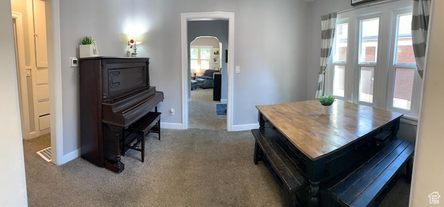 2425 Van Buren Ave, Ogden, UT 84401 - carpeted dining area with arched walkways and baseboards