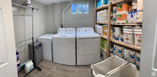 2425 Van Buren Ave, Ogden, UT 84401 - laundry area featuring washer and dryer and light wood-type flooring