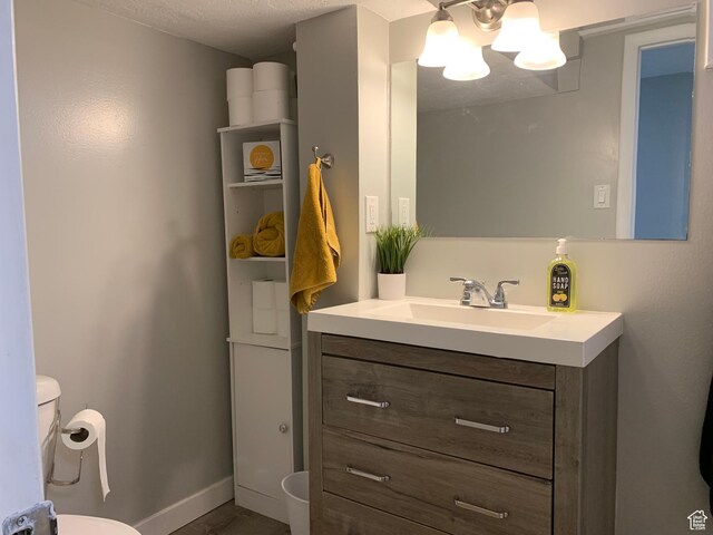2425 Van Buren Ave, Ogden, UT 84401 - half bathroom with vanity and a chandelier