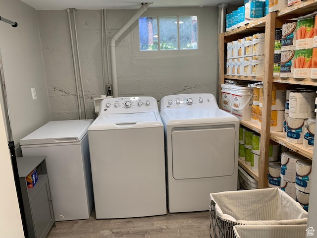 2425 Van Buren Ave, Ogden, UT 84401 - washroom with washing machine and clothes dryer and light wood-style flooring