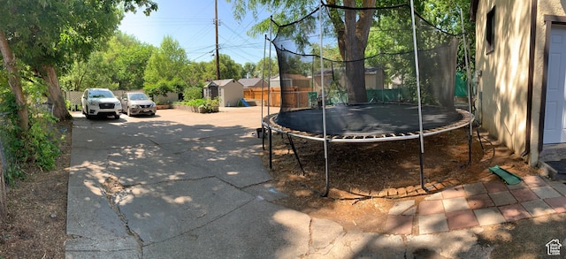 2425 Van Buren Ave, Ogden, UT 84401 - view of yard with a trampoline and a shed