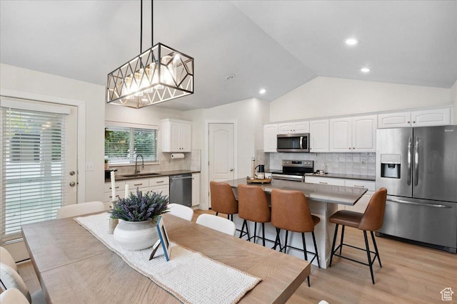 656 W 1310 N, Lehi, UT 84043 - dining space with vaulted ceiling, light wood-type flooring, and recessed lighting