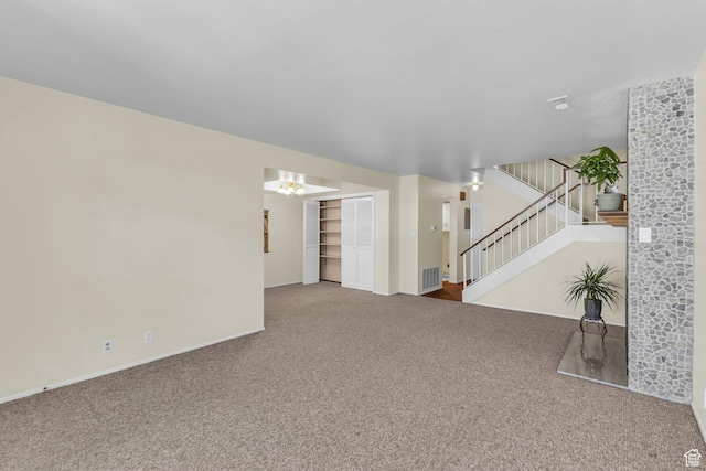 607 E 4030 S, Murray, UT 84107 - unfurnished living room with carpet flooring and stairs