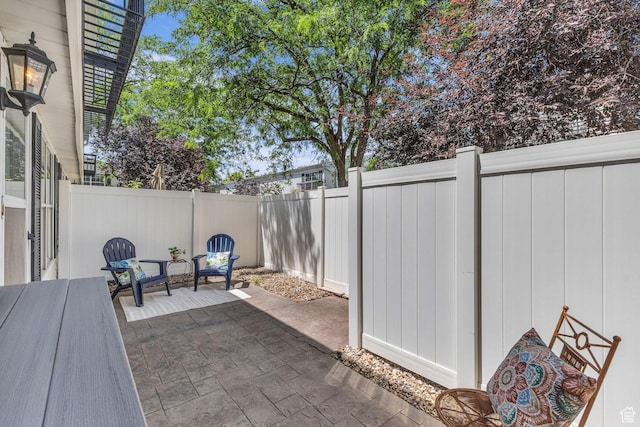 607 E 4030 S, Murray, UT 84107 - fenced backyard featuring a patio