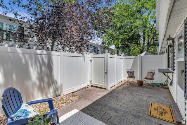 607 E 4030 S, Murray, UT 84107 - fenced backyard with a patio area and a gate