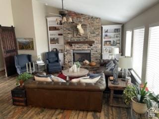 4613 W Brookport Cir S Unit V3-8, Herriman, UT 84096 - living area featuring lofted ceiling, wood finished floors, a ceiling fan, and a stone fireplace