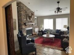 4613 W Brookport Cir S Unit V3-8, Herriman, UT 84096 - living area with a ceiling fan, wood finished floors, and a stone fireplace