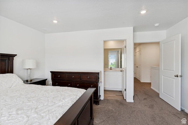 1826 N Blue Iris Ave, Tooele, UT 84074 - carpeted bedroom with recessed lighting and connected bathroom