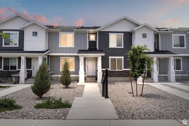1826 N Blue Iris Ave, Tooele, UT 84074 - view of front of home featuring board and batten siding and covered porch