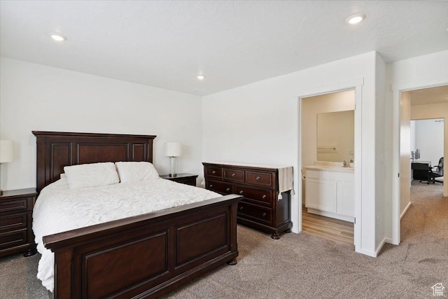1826 N Blue Iris Ave, Tooele, UT 84074 - bedroom featuring light colored carpet, recessed lighting, and ensuite bathroom