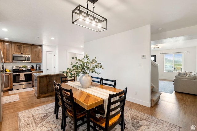 87 E Legacy Dr, Franklin, ID 83237 - dining space with light wood-type flooring, stairway, and recessed lighting