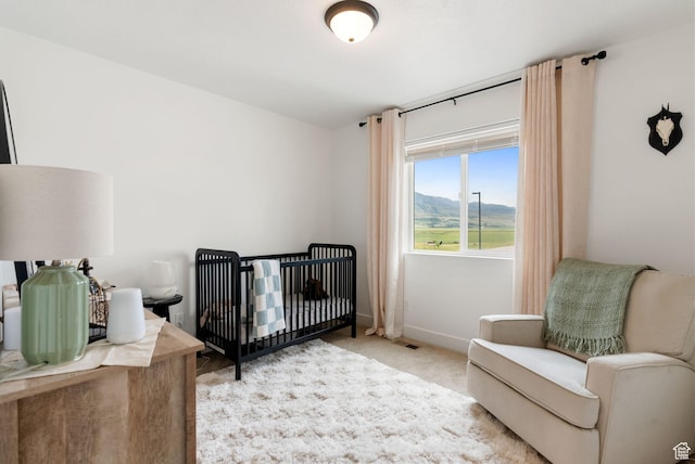 87 E Legacy Dr, Franklin, ID 83237 - carpeted bedroom featuring baseboards and a nursery area