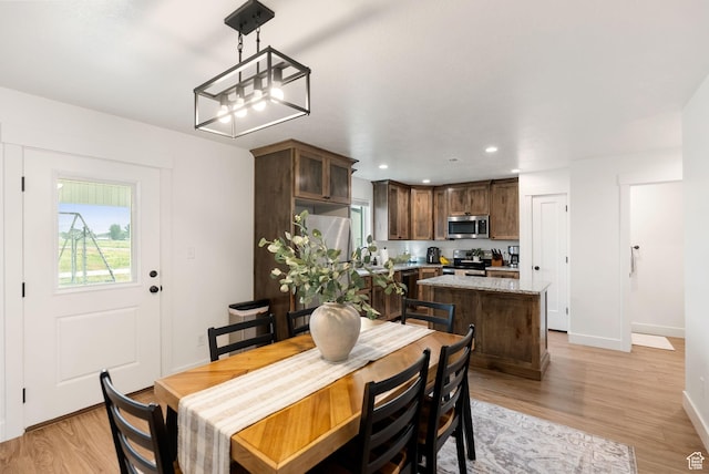 87 E Legacy Dr, Franklin, ID 83237 - dining space featuring light wood-type flooring and recessed lighting