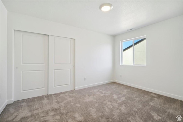 723 N Plainsman Dr Unit 109, Spanish Fork, UT 84660 - unfurnished bedroom featuring carpet floors and a closet