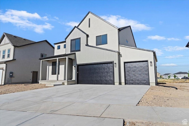 723 N Plainsman Dr Unit 109, Spanish Fork, UT 84660 - view of front of home featuring driveway, a garage, and an attached garage