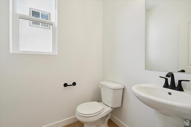 723 N Plainsman Dr Unit 109, Spanish Fork, UT 84660 - bathroom with baseboards and wood finished floors