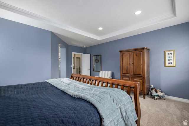 10453 N Canterbury Pl, Highland, UT 84003 - bedroom featuring light colored carpet, a tray ceiling, recessed lighting, arched walkways, and crown molding