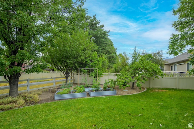 10453 N Canterbury Pl, Highland, UT 84003 - fenced backyard featuring a vegetable garden