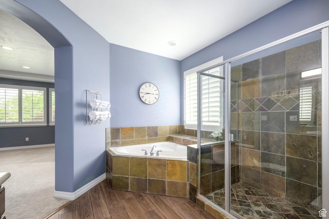 10453 N Canterbury Pl, Highland, UT 84003 - full bathroom with a garden tub, a stall shower, and wood finished floors