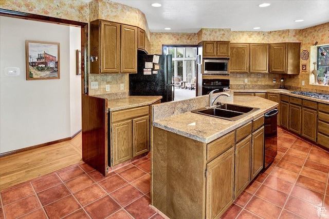 490 E 3475 N, North Ogden, UT 84414 - kitchen featuring black appliances, decorative backsplash, an island with sink, tile patterned flooring, and recessed lighting
