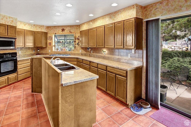 490 E 3475 N, North Ogden, UT 84414 - kitchen featuring appliances with stainless steel finishes, plenty of natural light, a center island, backsplash, and recessed lighting