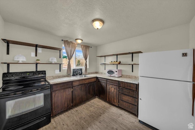 328 Pectol St, Washington, UT 84780 - kitchen featuring open shelves, white appliances, dark brown cabinetry, light wood-type flooring, and a textured ceiling