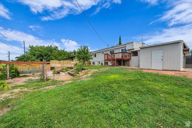 328 Pectol St, Washington, UT 84780 - view of yard with a vegetable garden, a deck, stairs, and a storage shed