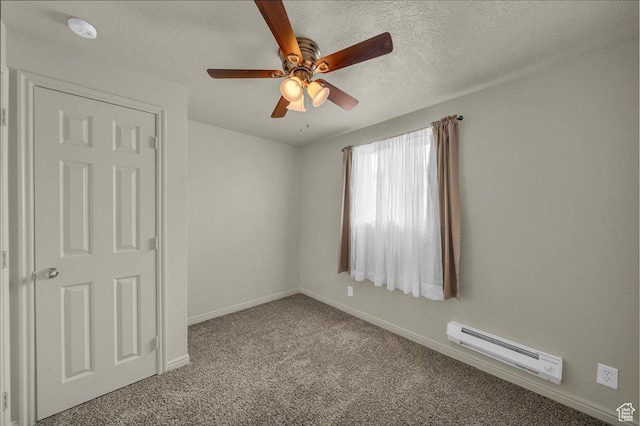 328 Pectol St, Washington, UT 84780 - carpeted spare room with a baseboard heating unit, a ceiling fan, a textured ceiling, and a smoke detector