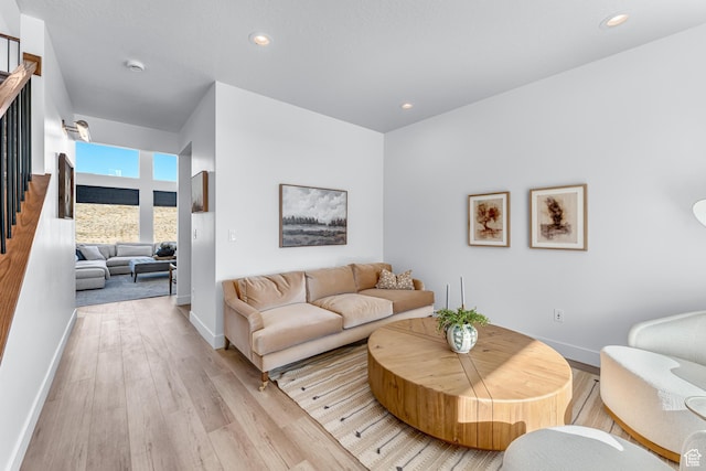 6957 W Farnsworth Peak Dr S Unit 314, West Jordan, UT 84081 - living area with light wood finished floors, stairs, and recessed lighting