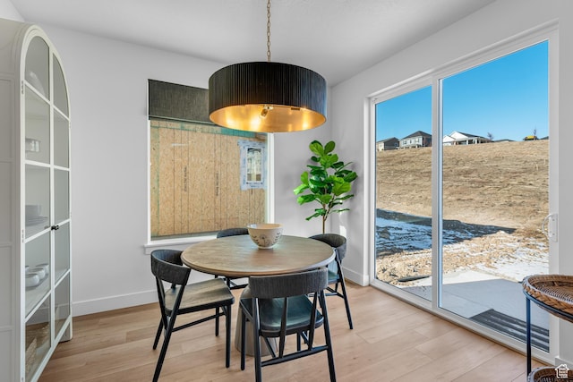6957 W Farnsworth Peak Dr S Unit 314, West Jordan, UT 84081 - dining area featuring light wood-style floors and healthy amount of natural light