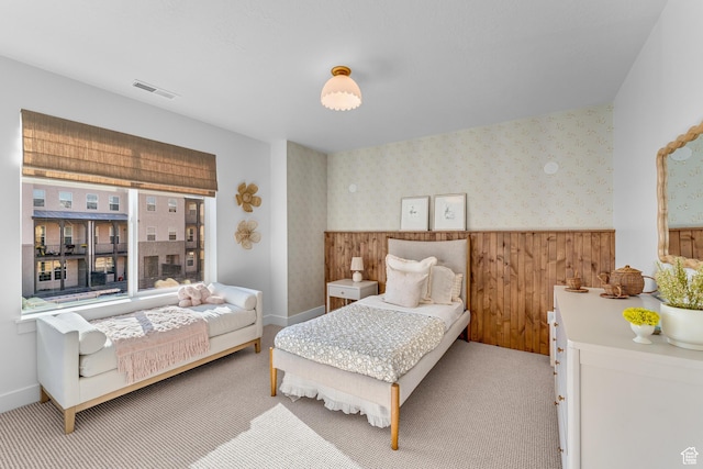 6957 W Farnsworth Peak Dr S Unit 314, West Jordan, UT 84081 - bedroom with a wainscoted wall, wallpapered walls, carpet, and wood walls