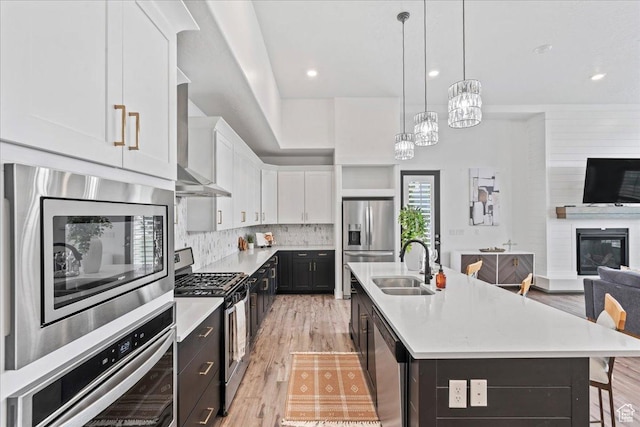 6153 W Poplar View Dr, South Jordan, UT 84009 - kitchen featuring appliances with stainless steel finishes, white cabinetry, light countertops, open floor plan, and recessed lighting