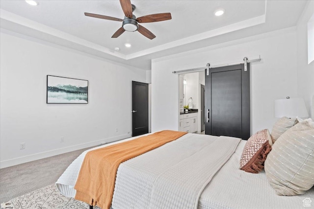 6153 W Poplar View Dr, South Jordan, UT 84009 - bedroom featuring carpet, a tray ceiling, a barn door, recessed lighting, and connected bathroom