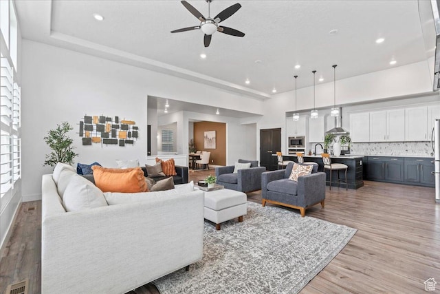 6153 W Poplar View Dr, South Jordan, UT 84009 - living room featuring a ceiling fan, light wood-style floors, and recessed lighting