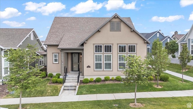 6153 W Poplar View Dr, South Jordan, UT 84009 - english style home featuring stucco siding, a front yard, and a shingled roof