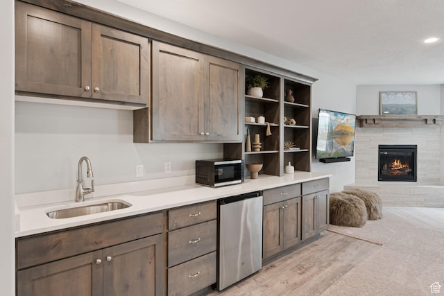 1968 W Silver Leaf Dr S, Mapleton, UT 84664 - kitchen with refrigerator, black microwave, open shelves, a glass covered fireplace, and light countertops