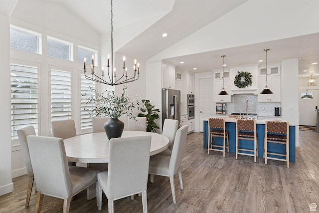 1968 W Silver Leaf Dr S, Mapleton, UT 84664 - dining room featuring lofted ceiling, recessed lighting, a chandelier, and wood finished floors