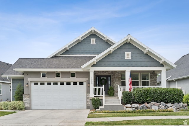 1968 W Silver Leaf Dr S, Mapleton, UT 84664 - craftsman house featuring stone siding, covered porch, a garage, driveway, and roof with shingles