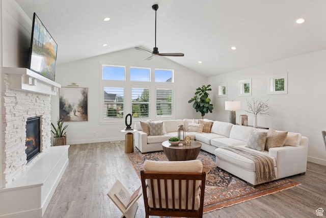 1968 W Silver Leaf Dr S, Mapleton, UT 84664 - living area featuring a ceiling fan, light wood finished floors, vaulted ceiling, a stone fireplace, and recessed lighting