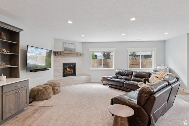 1968 W Silver Leaf Dr S, Mapleton, UT 84664 - living room featuring a tile fireplace, recessed lighting, and light colored carpet