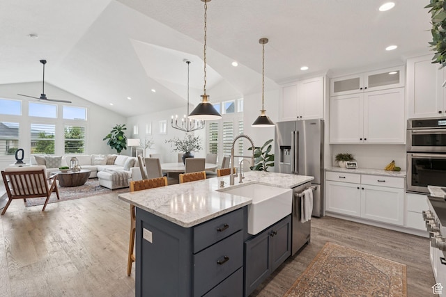 1968 W Silver Leaf Dr S, Mapleton, UT 84664 - kitchen with lofted ceiling, stainless steel appliances, white cabinets, gray cabinets, and light wood-style floors