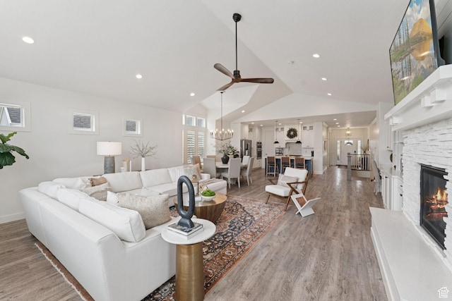 1968 W Silver Leaf Dr S, Mapleton, UT 84664 - living area featuring a ceiling fan, a chandelier, light wood-style flooring, recessed lighting, and a fireplace