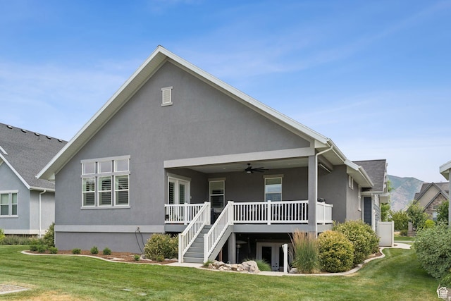 1968 W Silver Leaf Dr S, Mapleton, UT 84664 - back of house with ceiling fan, a lawn, and stucco siding