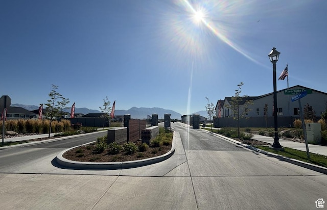246 E Polaris Dr Unit 109, Saratoga Springs, UT 84045 - view of concrete road featuring curbs, sidewalks, and a residential view