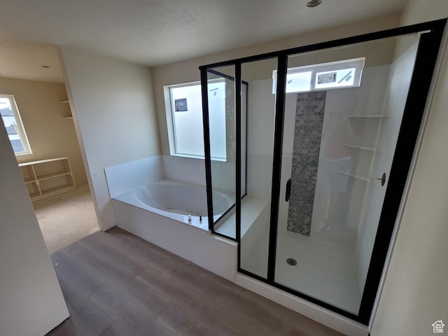 2909 S Richards View Rd Unit 6, Magna, UT 84044 - full bathroom with wood finished floors, a stall shower, and plenty of natural light