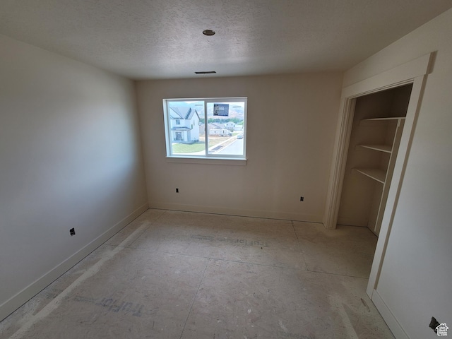 2909 S Richards View Rd Unit 6, Magna, UT 84044 - unfurnished bedroom featuring baseboards and a textured ceiling