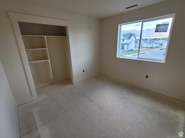 2909 S Richards View Rd Unit 6, Magna, UT 84044 - unfurnished bedroom featuring a closet and baseboards